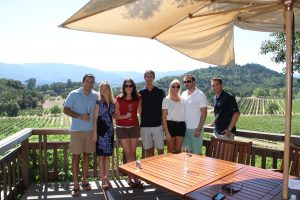 Elin Mendola posing with a group of people outside in the sun