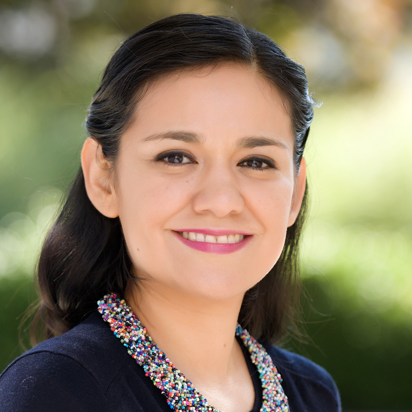 woman with black hair smiling