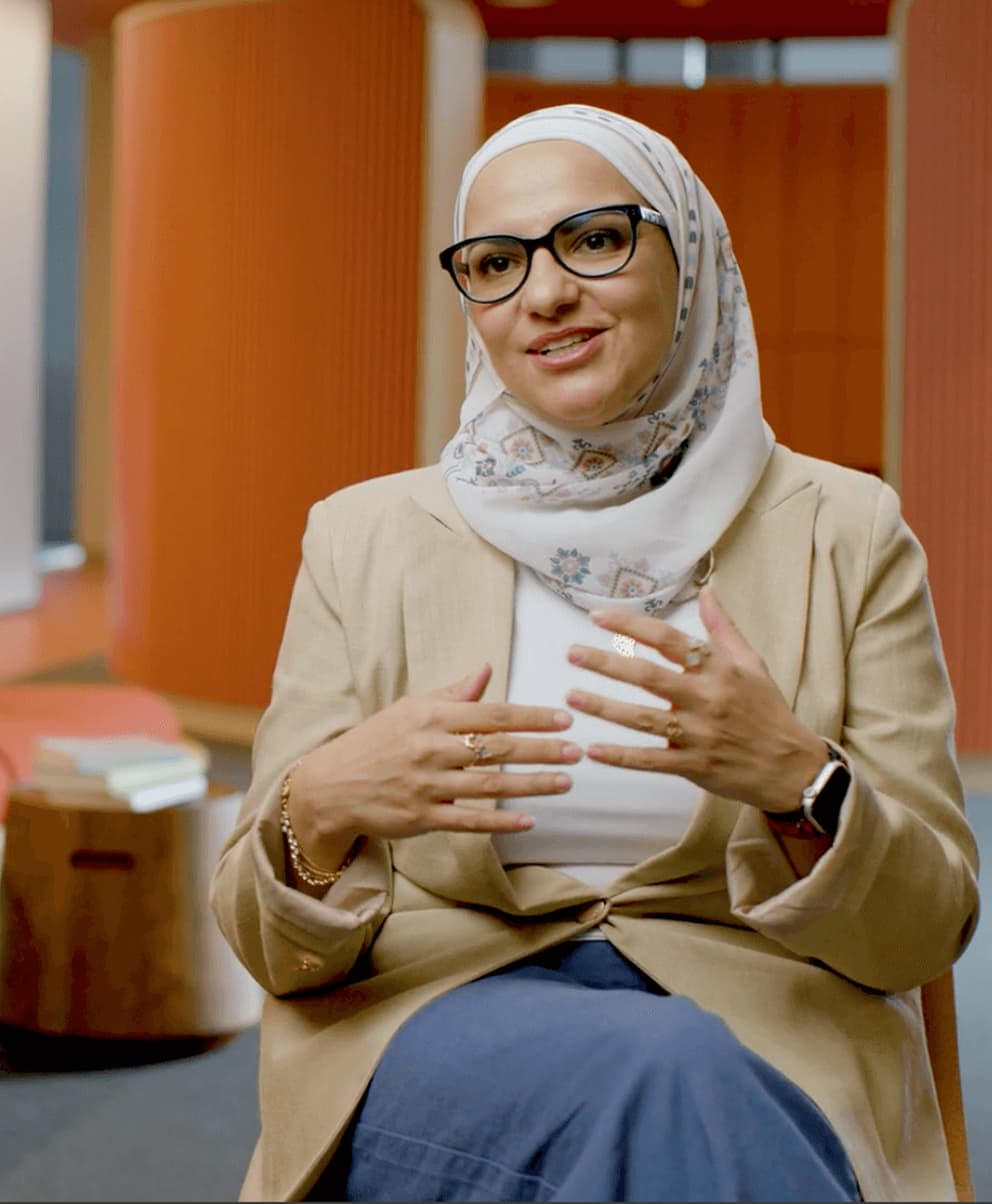 Expedia Group Commercial team member speaking in an office