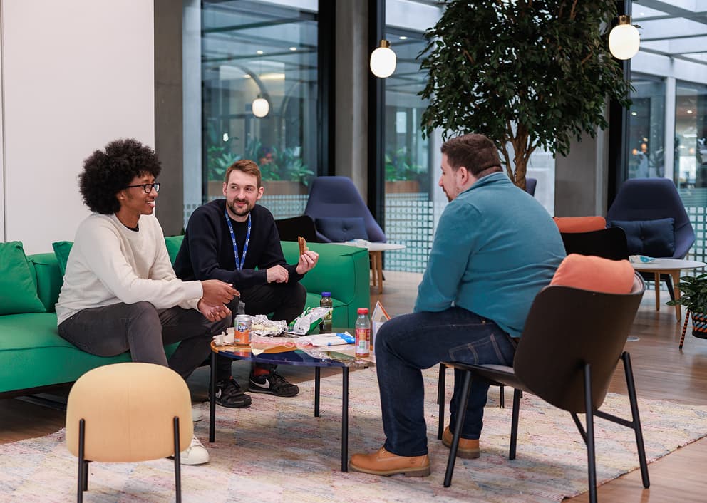 Expedia Group colleagues meeting in a lounge
